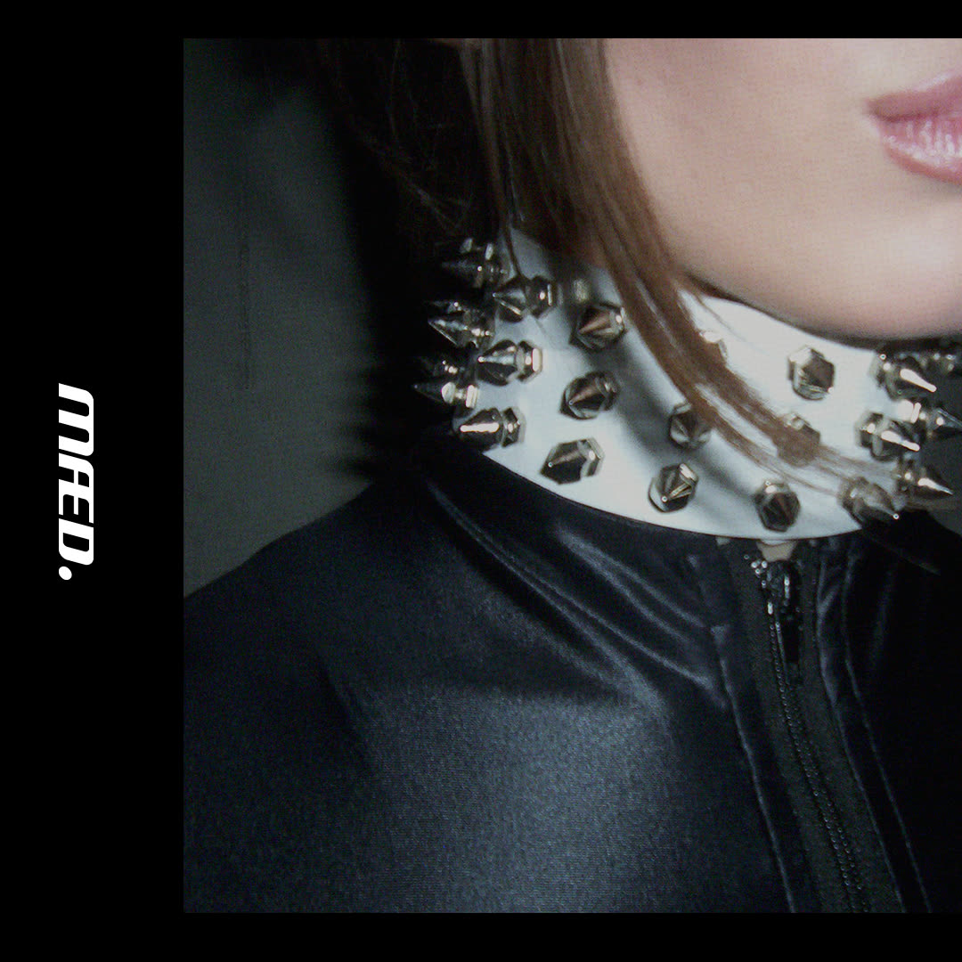 Spiked collar detail with MÆD logo